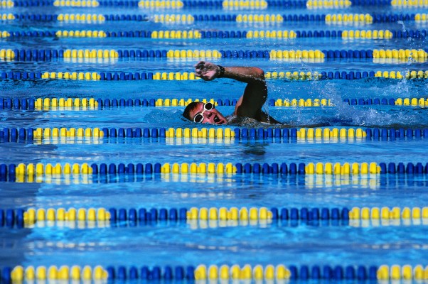 Man Swimming in Pool